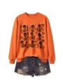 Women's Halloween orange crewneck sweatshirt featuring stylish skeleton and bow graphics. - S / Tops / Orange