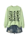 Women's cute Halloween skeleton graphic crewneck sweatshirt paired with denim shorts. - S / Tops / Olive Green