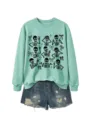 Women's mint green crewneck sweatshirt featuring stylish skeleton print paired with denim shorts. - S / Tops / Light Green