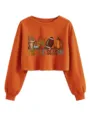 Vue détaillée du sweat orange court avec un imprimé graphique d'automne et du texte. - Orange Brûlé
