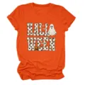 Close-up detail of the Halloween themed graphic print on the orange short sleeve t-shirt. - S / Tops / Orange