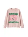 Close-up view of the cute dinosaur graphic and funny slogan printed on the pink sweatshirt. - Lotus root pink