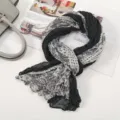 Close-up detail of black and white paisley print pleated linen scarf, elegant long shawl design. - Floral Pleated Style 3 Black