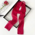Close-up detail of vibrant red sheer long scarf ribbon, lightweight and elegant accessory. - Red