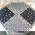 Detail view of a retro grey square silk scarf with geometric borders and elegant printed floral motifs. - Four-Palace Wheat Ear Gray Black