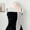Close-up detail of light pink chiffon narrow scarf with delicate white lace butterfly trim. - Three Butterfly Scarf - Bud Color