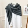 Detail view of stylish grey and white striped knit triangular scarf shawl for women daily wear. - Dark Gray White Stripe
