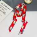 Red cat print silk scarf detail view, elegant long ribbon for hair and neck styling accessory daily. - Red Cat