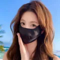 Close-up detail of the breathable black sun protection mask worn outdoors in summer. - One Size / Medium Breathable Mesh Mask - Black