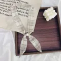 Plaid narrow scarf detail, elegant neck ribbon with faux pearl ring, versatile fashion accessory. - Black Line Beige Plaid Base