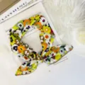 Detailed view of a retro floral square scarf with delicate lace edge, soft and breathable. - 70cm Wave Edge / Green Coffee Orange Flower