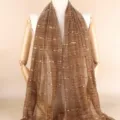 Detailed view of the elegant brown sequin gauze scarf, featuring shimmering gold stripe details. - Mocha Brown