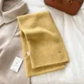 Cozy yellow knitted winter scarf with metal charm detail, soft wool texture warm neck wrap for women. - Lemon Yellow