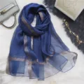 Blue sheer long silk scarf with metallic glitter stripes for women's spring fashion. - Gold Edged Navy
