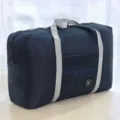 Large capacity travel duffel bag, dark blue folding storage bag with dual handles for clothes. - Navy Blue