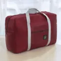 Large capacity travel storage duffel bag in wine red with grey handles for luggage and moving. - Burgundy