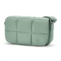 Detail view of a small sage green quilted nylon crossbody bag with puffy cloud design. - Light Green