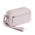 Close-up detail of the pink multi-zipper wristlet wallet, showing zippers and wrist strap. - Lotus Pink