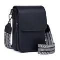 Detailed view of black PU leather crossbody bag featuring a stylish black and white woven strap. - Black