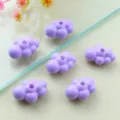 Detailed close-up of glossy purple acrylic cloud beads with center holes for jewelry DIY. - 3D Style / Light Purple