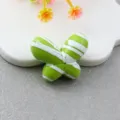 Green and white striped fat butterfly bead detail shot, perfect for DIY phone charms and jewelry making. - Apple Green