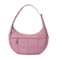 Close-up view of the pink quilted shoulder bag showing soft puffy fabric texture and fine stitching detail. - Deep Pink