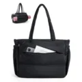 Detail view of black quilted puffer tote bag, large capacity shoulder bag with front pocket. - Black