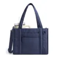 Dark blue quilted tote bag detail view, featuring a spacious interior and front pocket. - Navy Blue