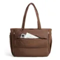 Brown quilted puffer tote bag detail, showing soft padded fabric and front zipper pocket. - Coffee