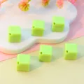 Light green acrylic cube beads with diagonal holes, perfect for DIY jewelry making and phone charms. - Light Green