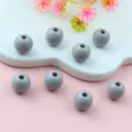 Close-up detail of grey solid acrylic round spacer beads, perfect for DIY jewelry making. - 8mm / Gray