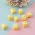 Detailed shot of yellow faceted square acrylic beads, perfect for DIY jewelry making and spacer use. - Style A Light Yellow 8mm