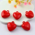 Glossy red acrylic heart charms with loops, perfect for DIY jewelry and cute crafting details. - Red
