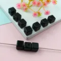 Detailed view of black square acrylic beads for DIY jewelry making and bracelet crafting. - Black