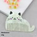 Detailed view of the cute acrylic cat shaped comb pendant with nice printed details. - Cat Green