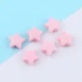 Detail shot of pink glitter star loose beads, perfect for DIY jewelry making and craft projects. - Pentagram / 10mm / Pink
