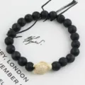 Volcanic stone beaded bracelet with cute turtle charm elastic natural stone jewelry for women detail view - Lava Stone Style