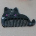 Acrylic cat hair comb with cute design, black marble pattern and hanging hole accessory. - Cat Black