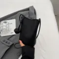 Petit sac bandouliere telephone en cuir PU noir avec laniere noeud elegante et design chic. - Noir