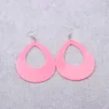 Detailed view of pink teardrop hollow acrylic earrings with silver fishhook wires for women. - Pink Teardrop