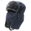 Detail shot of thick winter trapper hat in dark blue, featuring windproof mask and warm earflaps. - One Size / Navy Blue