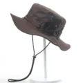 Brown outdoor bucket hat with adjustable chin strap and breathable eyelets for sun protection. - One Size / Coffee