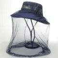 Close-up of the breathable mesh design and mosquito net on the outdoor fishing sun hat. - Navy Blue
