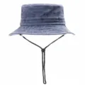Detailed view of the washed denim bucket hat featuring an adjustable black chin strap. - 54-59cm / Denim Blue