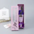 Detail view of a pink gift box containing a 3-rose soap flower bouquet for Valentine Day. - Flower Bouquet Gift Box / Purple