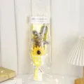 Detailed view of the cute rabbit doll dried flower bouquet with sunflower and warm lights. - Gypsophila Bunny Sunflower with LED Light and Gift Bag