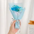 Close-up detail of a charming mini blue gypsophila and rose bouquet, perfect for gifting. - Height approx 16cm / Light Blue