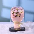Detailed view of eternal rose glass dome with fairy lights, romantic gift for girlfriend. - 9 Roses Glass Cover with LED Lights and Handbag / Pink