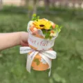 Detailed view of the handmade knitted sunflower bouquet, elegant gift packaging design. - 6-Flower Bouquet / Yellow Sunflower