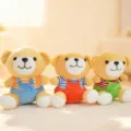 Close-up detail of cute cartoon plush overall bears, soft stuffed toy dolls for kids. - Overall Bear / 19cm